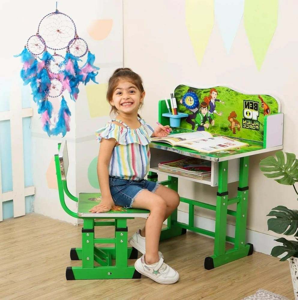 Girl sitting at Ben 10 Alien Force Kids Study Desk and Chair Set - Green