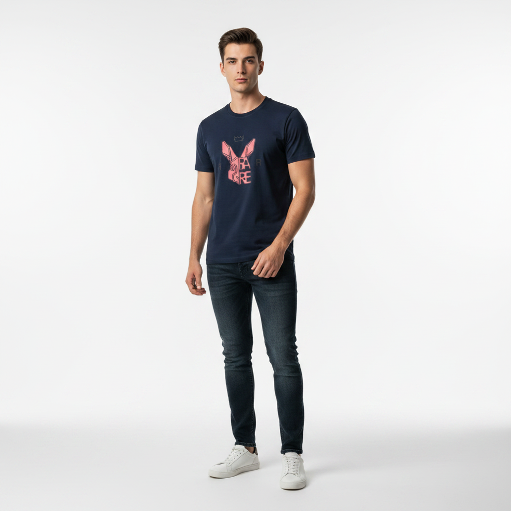 Man wearing navy blue Rare Rabbit tee in minimalist studio with dramatic lighting