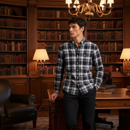 Man wearing black white plaid shirt in dark wood-paneled library