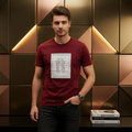 Man wearing maroon Rare Rabbit crystal R tee against dark bronze geometric gold wall