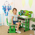 Girl sitting at Ben 10 Alien Force Kids Study Desk and Chair Set - Green